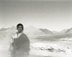 Nomadien shepherd in steam of Tibetan gusher